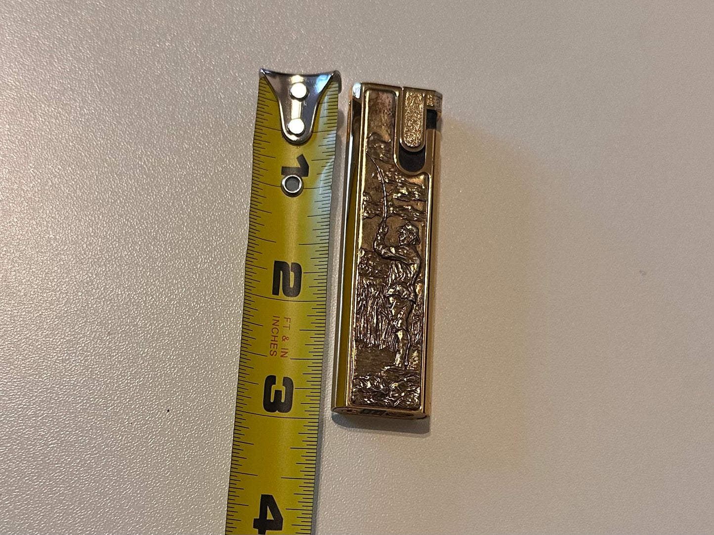 Vintage Flamex Toronado Lighter Featuring Raised Fly Fisherman 3" Gold Tone